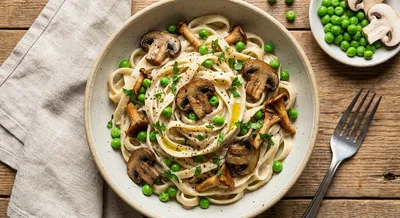 Creamy Vegan Alfredo with Fresh Peas and Mushrooms